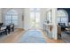Bright entryway with hardwood floors, and views to dining and living areas at 3260 Bayou Rd, Longboat Key, FL 34228