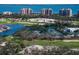 Aerial of golf course, tennis courts, and clubhouse at 3260 Bayou Rd, Longboat Key, FL 34228