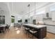 Modern kitchen with large island, white cabinets, and stainless steel appliances at 3260 Bayou Rd, Longboat Key, FL 34228