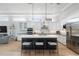 Bright kitchen with an island, double ovens, and stainless steel appliances at 3260 Bayou Rd, Longboat Key, FL 34228