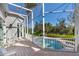 Enjoy the sunny Florida weather from this screened-in patio with pool access at 3260 Bayou Rd, Longboat Key, FL 34228