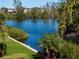 Serene canal-front view with tropical foliage at 3260 Bayou Rd, Longboat Key, FL 34228