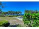 Kayaks on a scenic waterfront backyard with lush landscaping at 367 Compass Point Dr # 201, Bradenton, FL 34209