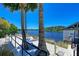 Relaxing waterfront view with hammocks and palm trees at 367 Compass Point Dr # 201, Bradenton, FL 34209