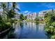 Picturesque pond with building reflection at 380 Gulf Of Mexico Dr # 525, Longboat Key, FL 34228