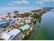 Aerial view of waterfront home with beach and waterway access at 411 S Casey Key Rd, Nokomis, FL 34275