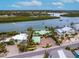 Aerial view of waterfront home with large lot and boat access at 411 S Casey Key Rd, Nokomis, FL 34275
