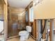 Partially renovated bathroom with new shower at 411 S Casey Key Rd, Nokomis, FL 34275