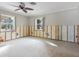 Unfinished bedroom with wood paneling and new flooring at 411 S Casey Key Rd, Nokomis, FL 34275