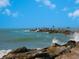 People fishing on a pier with waves at 411 S Casey Key Rd, Nokomis, FL 34275