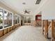 Gathering room with water damage and exposed framing at 411 S Casey Key Rd, Nokomis, FL 34275