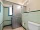 Laundry room with washer, dryer, and toilet at 411 S Casey Key Rd, Nokomis, FL 34275