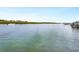 Calm waterway view with boats and lush mangrove shoreline at 411 S Casey Key Rd, Nokomis, FL 34275