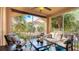 Screened balcony with seating area, offering a relaxing outdoor space at 4142 Central Sarasota Pkwy # 1428, Sarasota, FL 34238