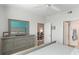 Comfortable bedroom with dresser, mirror, and view of living area at 4142 Central Sarasota Pkwy # 1428, Sarasota, FL 34238