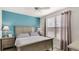 Spacious bedroom with large bed, nightstands, and window at 4142 Central Sarasota Pkwy # 1428, Sarasota, FL 34238