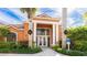 Community clubhouse with columns and festive decor at 4142 Central Sarasota Pkwy # 1428, Sarasota, FL 34238