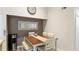 Small dining area with a wooden table and four chairs, suitable for casual meals at 4142 Central Sarasota Pkwy # 1428, Sarasota, FL 34238