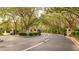 Gated entrance to community with lush landscaping at 4142 Central Sarasota Pkwy # 1428, Sarasota, FL 34238