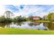 Serene pond with water fountain, reflecting community at 4142 Central Sarasota Pkwy # 1428, Sarasota, FL 34238
