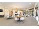 Bright community room with multiple tables and chairs, perfect for gatherings at 4363 Kariba Lake Ter, Sarasota, FL 34243
