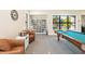 Game room with a billiard table and comfortable seating at 4363 Kariba Lake Ter, Sarasota, FL 34243