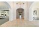 Elegant hallway with arched entryways and tiled floors at 4363 Kariba Lake Ter, Sarasota, FL 34243