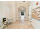Residential hallway with tiled floors and community bulletin board at 4363 Kariba Lake Ter, Sarasota, FL 34243