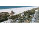 Aerial view of Siesta Beach with beachgoers and volleyball courts at 4937 Oxford Dr, Siesta Key, FL 34242