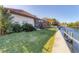 Landscaped backyard with canal access and dock at 4937 Oxford Dr, Siesta Key, FL 34242