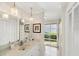 Clean bathroom with single vanity, and access to private patio at 4937 Oxford Dr, Siesta Key, FL 34242
