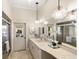 Elegant bathroom with double vanity, marble countertops, and large shower at 4937 Oxford Dr, Siesta Key, FL 34242