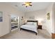 Bedroom with large windows and comfortable bed at 4937 Oxford Dr, Siesta Key, FL 34242