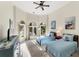 Bright bedroom featuring two twin beds and access to a patio at 4937 Oxford Dr, Siesta Key, FL 34242