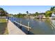 Scenic canal-front property with private dock and lush landscaping at 4937 Oxford Dr, Siesta Key, FL 34242