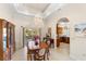 Elegant dining room with hardwood table and kitchen access at 4937 Oxford Dr, Siesta Key, FL 34242