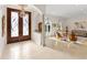 Elegant entryway with double doors and a chandelier at 4937 Oxford Dr, Siesta Key, FL 34242