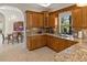 Kitchen corner with granite countertops and wood cabinets at 4937 Oxford Dr, Siesta Key, FL 34242