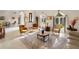 Bright living room with large windows and comfortable seating at 4937 Oxford Dr, Siesta Key, FL 34242