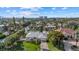 Aerial view of a canal-front home with a large backyard and lush landscaping at 5164 Windward Ave, Sarasota, FL 34242