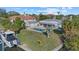 Home features pool, dock, and lush landscaping at 5164 Windward Ave, Sarasota, FL 34242