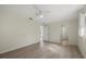 Spacious bedroom with light walls and wood-look flooring, offering access to other areas at 5164 Windward Ave, Sarasota, FL 34242