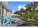 Relaxing deck with teal Adirondack chairs at 5164 Windward Ave, Sarasota, FL 34242