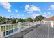Spacious deck with white railings and canal views at 5164 Windward Ave, Sarasota, FL 34242