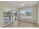 Bright dining room with sliding doors to patio and pool at 5164 Windward Ave, Sarasota, FL 34242