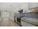 Updated kitchen with white cabinets and granite counters at 5164 Windward Ave, Sarasota, FL 34242