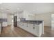 Renovated kitchen boasting white cabinets and granite countertops at 5164 Windward Ave, Sarasota, FL 34242