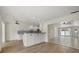 Bright kitchen features white cabinets, granite countertops, and tile backsplash at 5164 Windward Ave, Sarasota, FL 34242