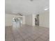 Spacious living room with tile flooring and access to the back patio at 5164 Windward Ave, Sarasota, FL 34242