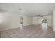 Bright and airy living room with tile floors and access to other rooms at 5164 Windward Ave, Sarasota, FL 34242